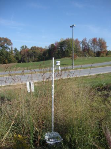 logger on post at rain garden